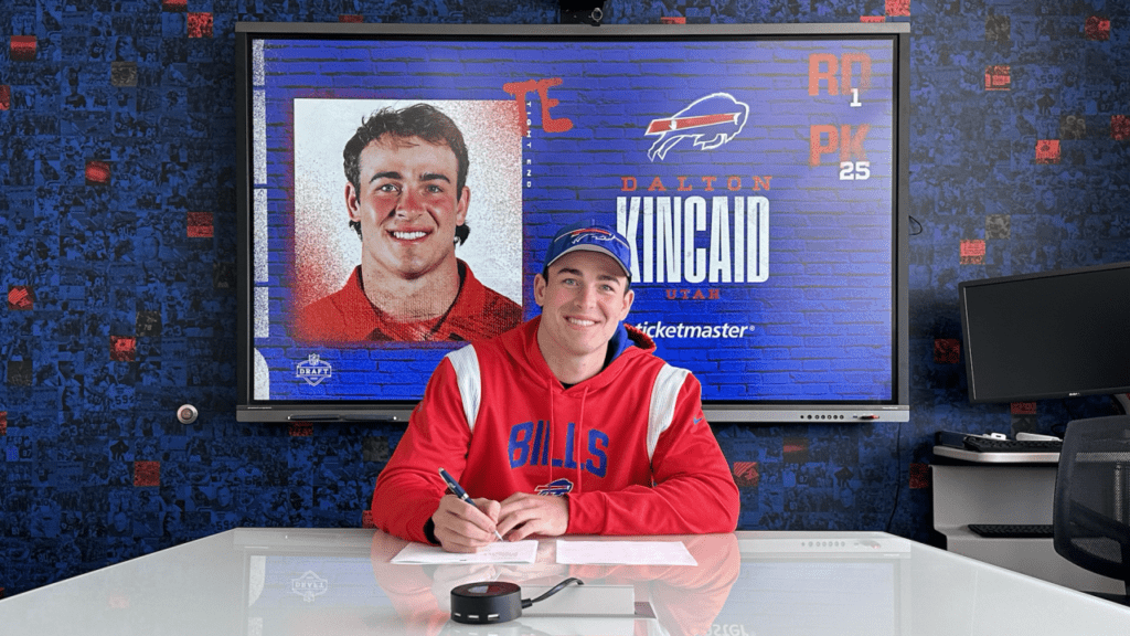 Dalton Kincaid signs his rookie tender after the NFL Draft